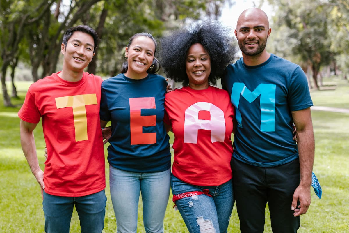 a team of four wearing team shirt